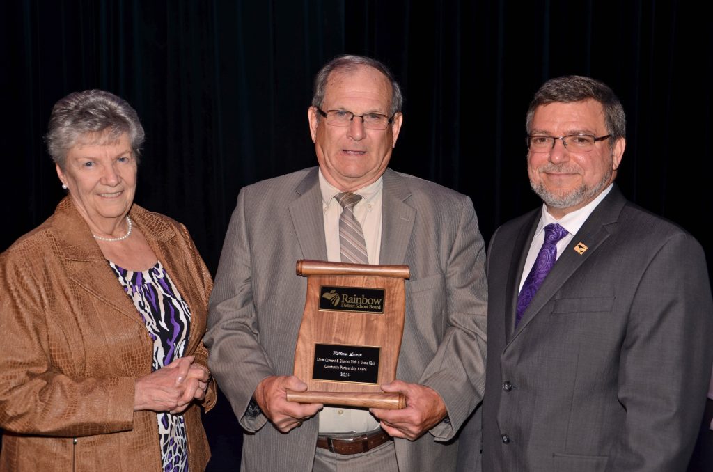 A staff member accepting an award