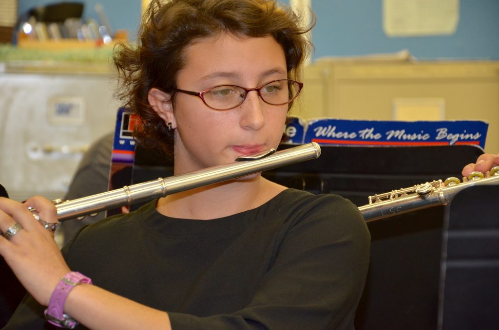 An image of a student playing the flute.