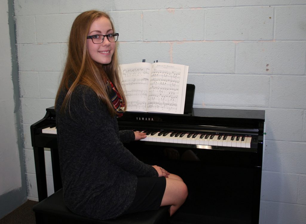 An image of a student playing piano