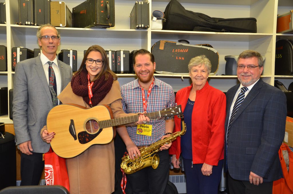 A donation presentation with staff from NewCap.