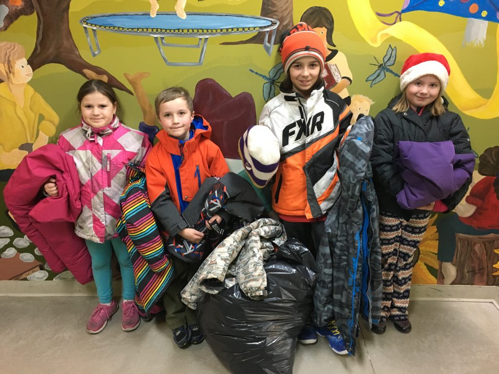 Students standing with winter clothing