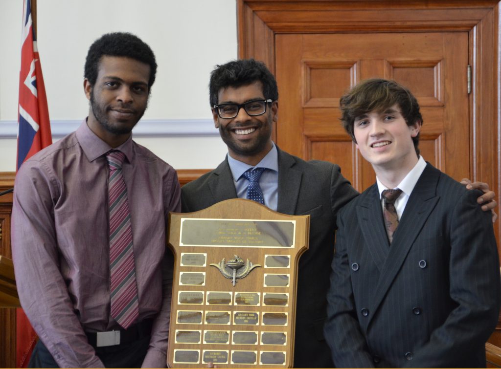 An image of students with an award