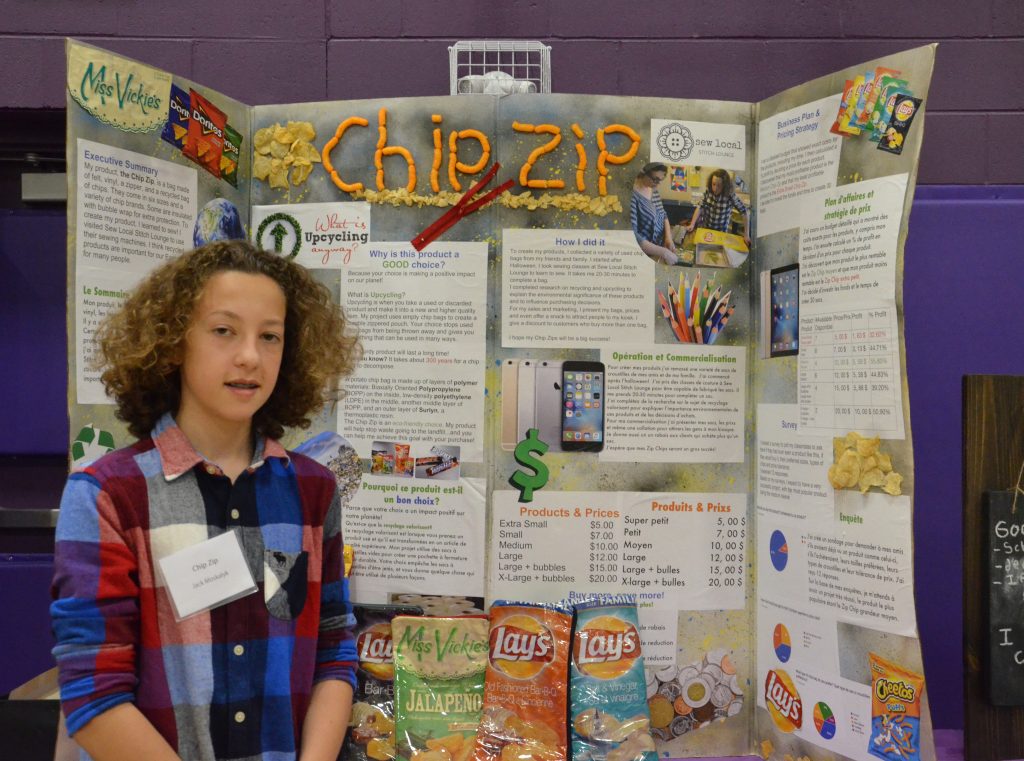Image of a student with their entrepreneurship fair project