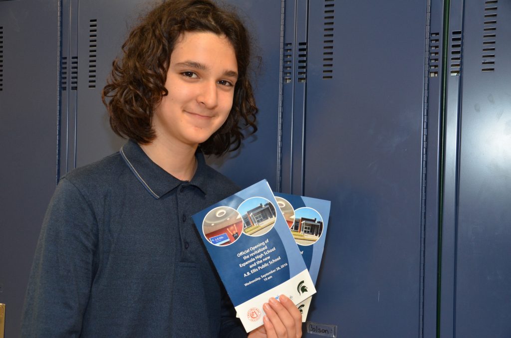 Image of student holding opening flyers