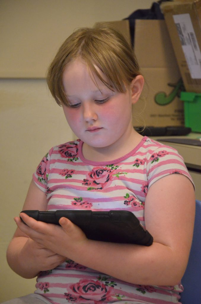 student working on an ipad