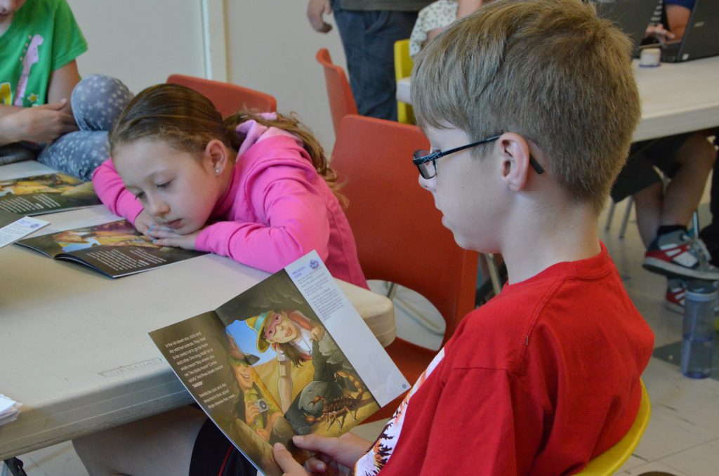 a student reading a leaflet