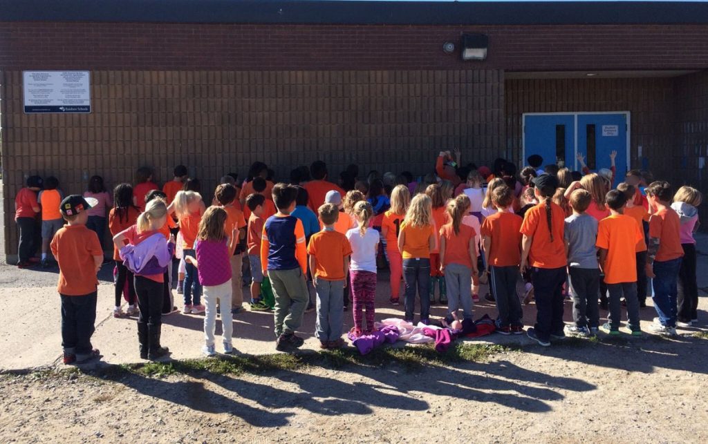 an image of students wearing orange