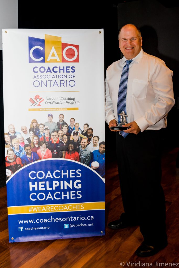 An image of Denis Gauthier accepting his award