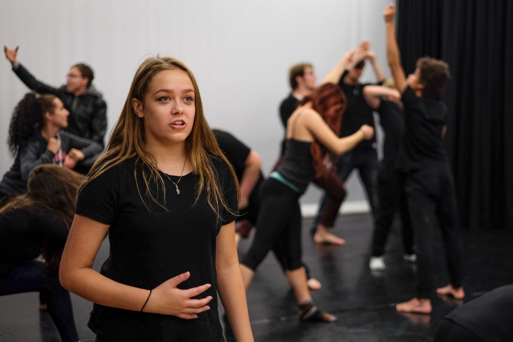 An image of a student about to sing on a stage