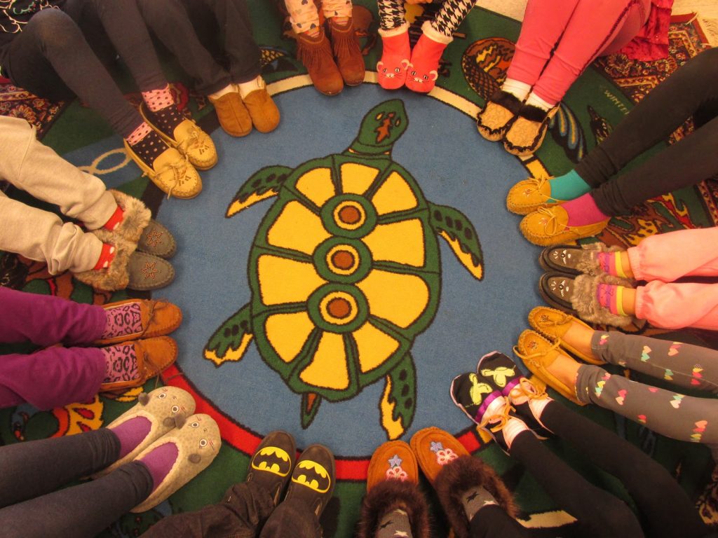 Students wearing Moccasins