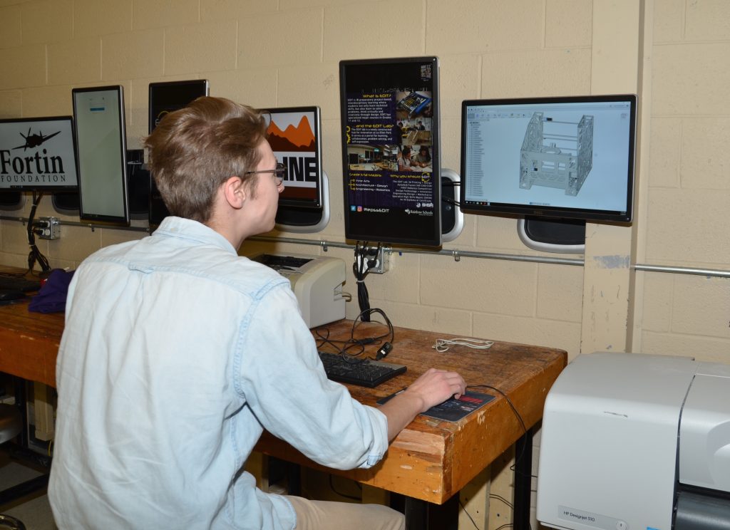 A student using AUTO CAD Design software