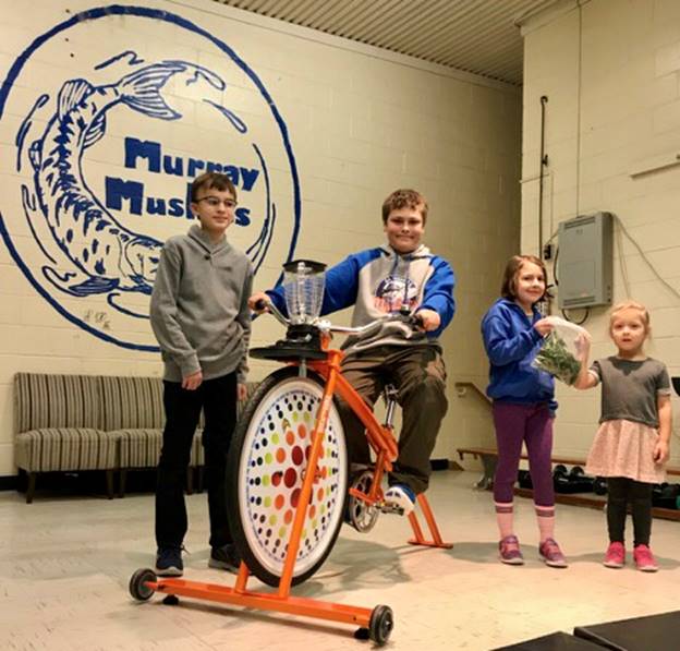 Student riding the smoothie bike