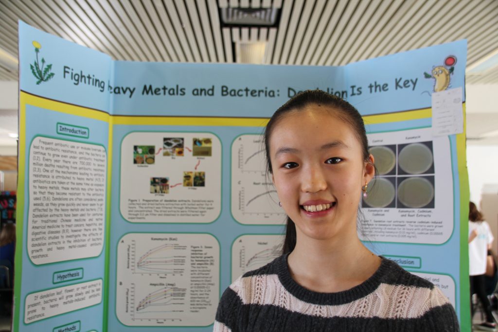 Student Kerry Yang with her science fair project