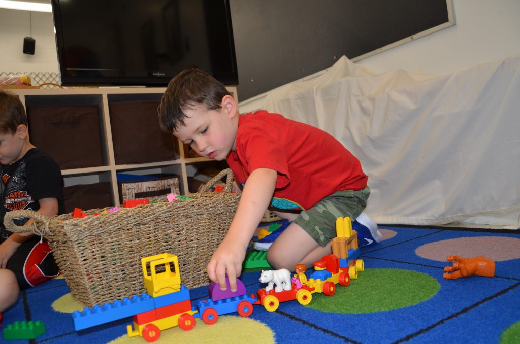 Jack Mallory makes a train with building blocks during the Kindergarten Camp at Algonquin Road Public School.