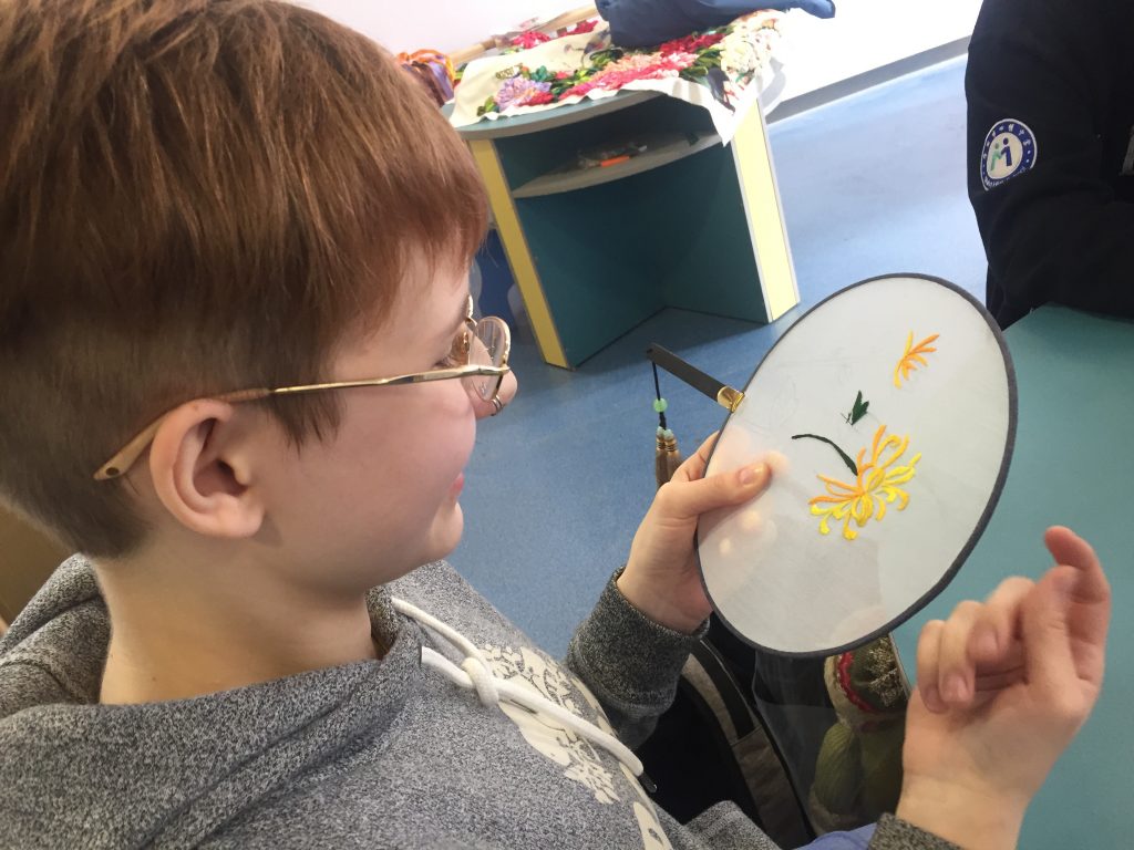 A student taking part in embroidery.