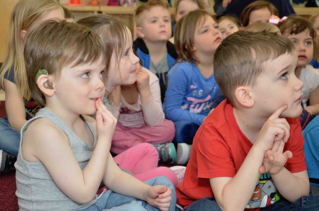 Kindergarten children listening to a story