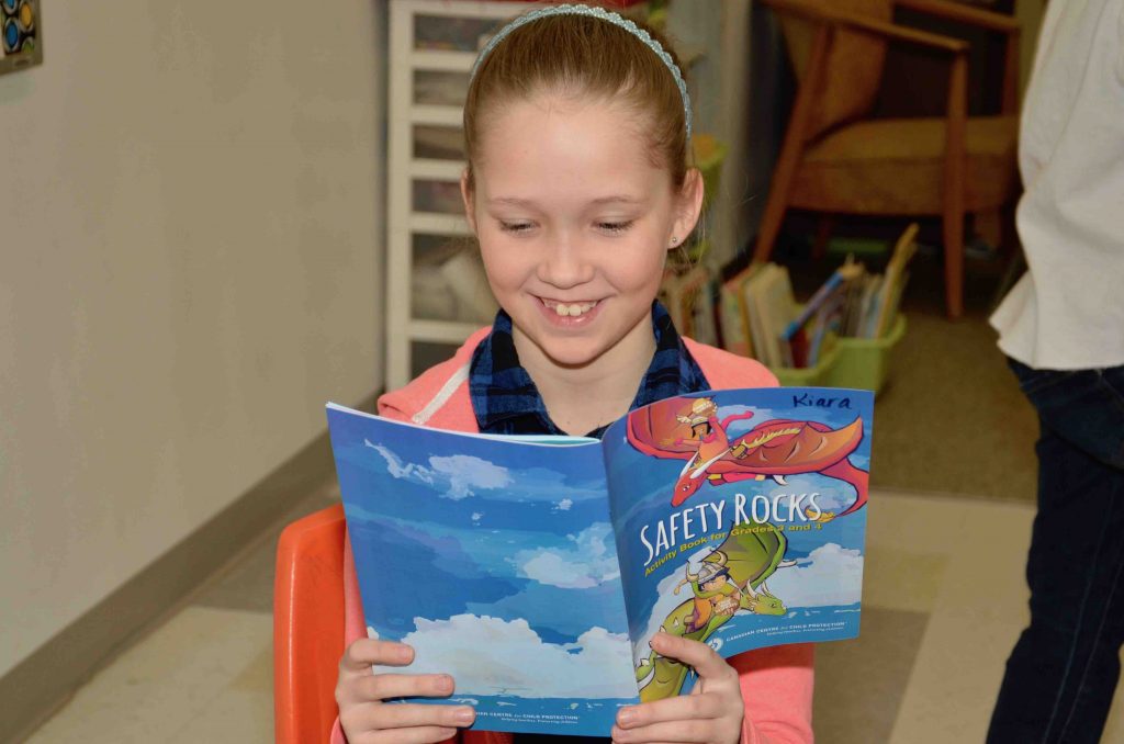 A student reading a booklet