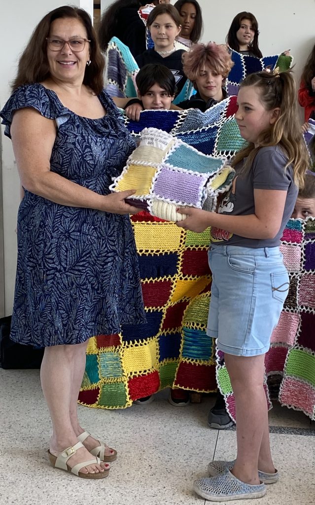 Craft for a Cause Students knit blankets for patients with cancer