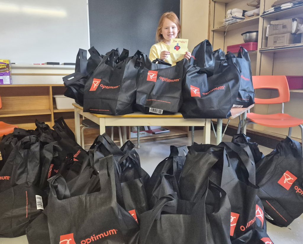 R.L. Beattie Public School student Addalie Golanski, who helped assemble the “Thankful for Comfort” bundles, proudly displays the donations prepared for the Elgin Street Mission.