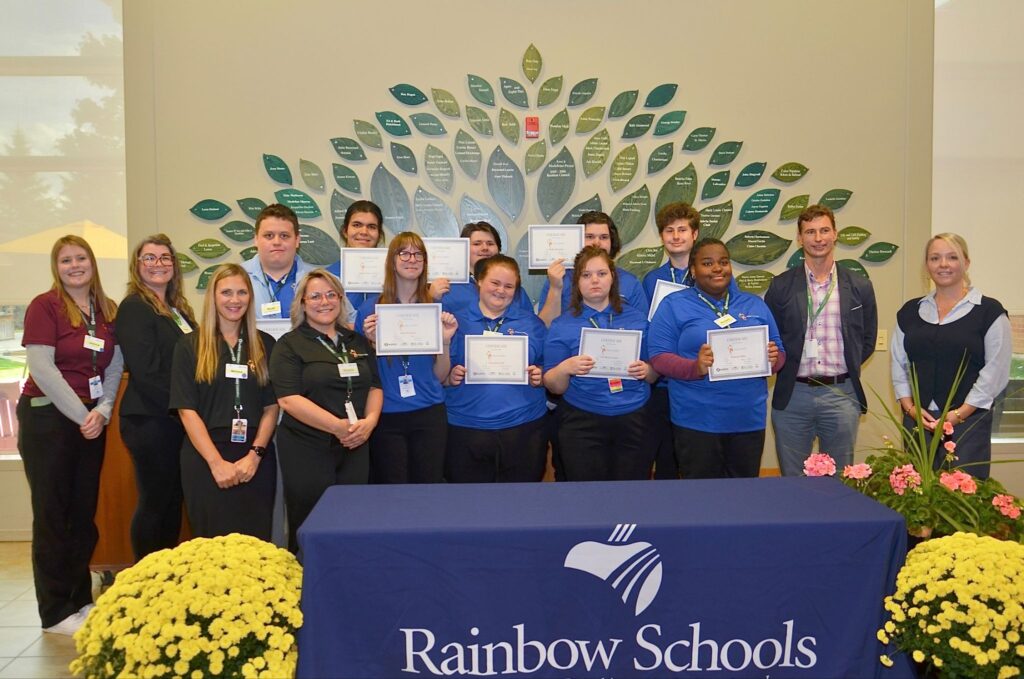 Certificates of Internship were presented to this year’s group of Project SEARCH Pioneer Manor participants during a signing ceremony on October 7, 2026. Participating were, back row, from left, Jessica MacPhail, Skills Trainer, March of Dimes Canada; Nicole Leclair, Director of Long-Term Care Services, City of Greater Sudbury; students Wyatt Whitmore, Edison Fox-Corbiere, Daniel MacKinnon, Blake Boucher and Bayden Azzeh; Tyler Campbell, General Manager of Community Well-Being, City of Greater Sudbury; and Jennifer Way, Senior Manager - Skills Development and Employment, March of Dimes Canada; and, front row, from left, Melissa Shaw, Teacher, Rainbow District School Board; Shaylee Savoie, Skills Trainer, March of Dimes Canada; students Kali Rouleau, Keyanna Self, Ashley Martin Allarie and Nureein Bakr. Unable to attend was student Jake Mongrain.