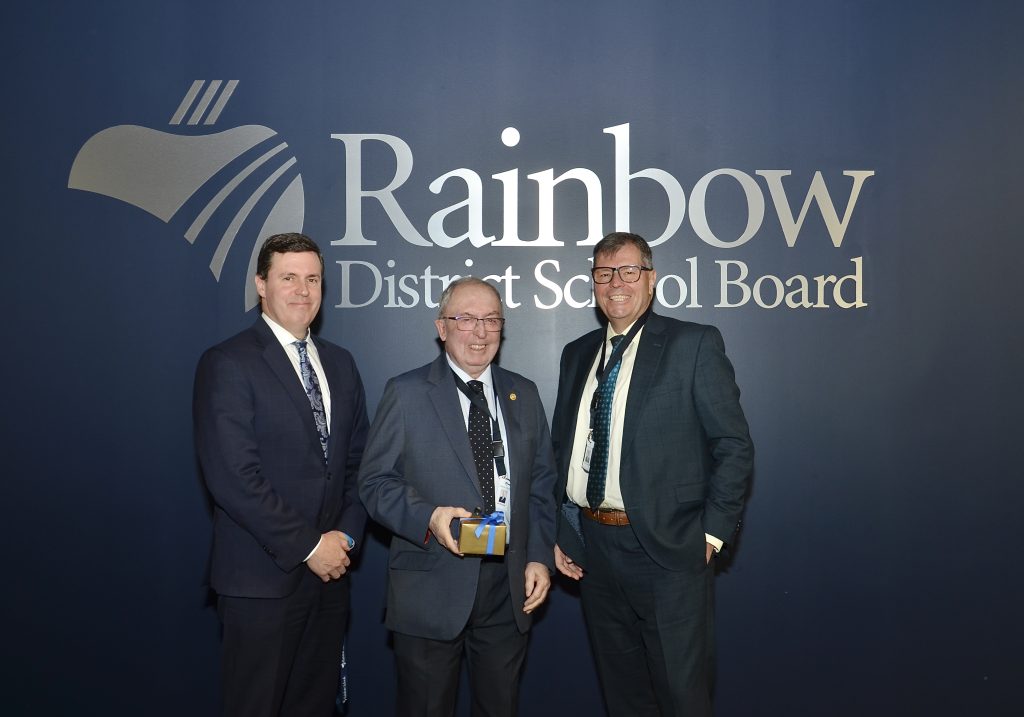 Rainbow District School Board Chair David Farrow and CEO Bruce Bourget, left, thank Trustee Alex McCauley for his contribution to the Board. Trustee McCauley has served as Vice-Chair of the Board for the past two years.