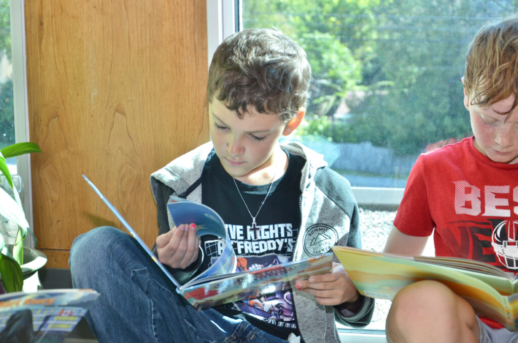 Lansdowne Public School students Owen Williams-Gies, left, and Nathaniel Galvin, share their love of reading.