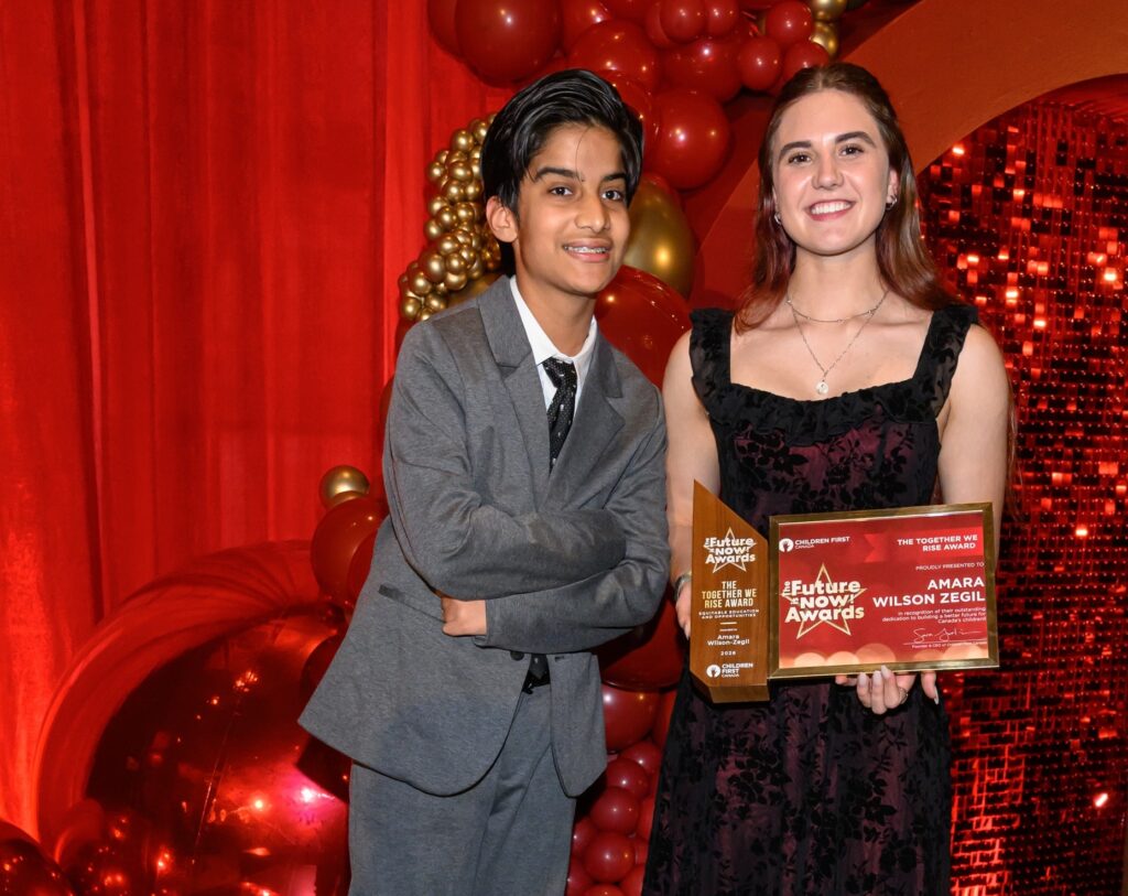 Amanda Wilson-Zegil receives The Together We Rise Award for Equitable Education and Opportunities from Rayn Asaria, a member of the Youth Advisory Council for Children First Canada.